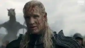 Cena do trailer da temporada 3 de A Casa do Dragão com dragão ao fundo
