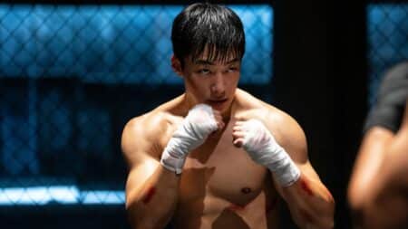 Cena final de Cães de Caça temporada 2 com Gun-woo em confronto intenso