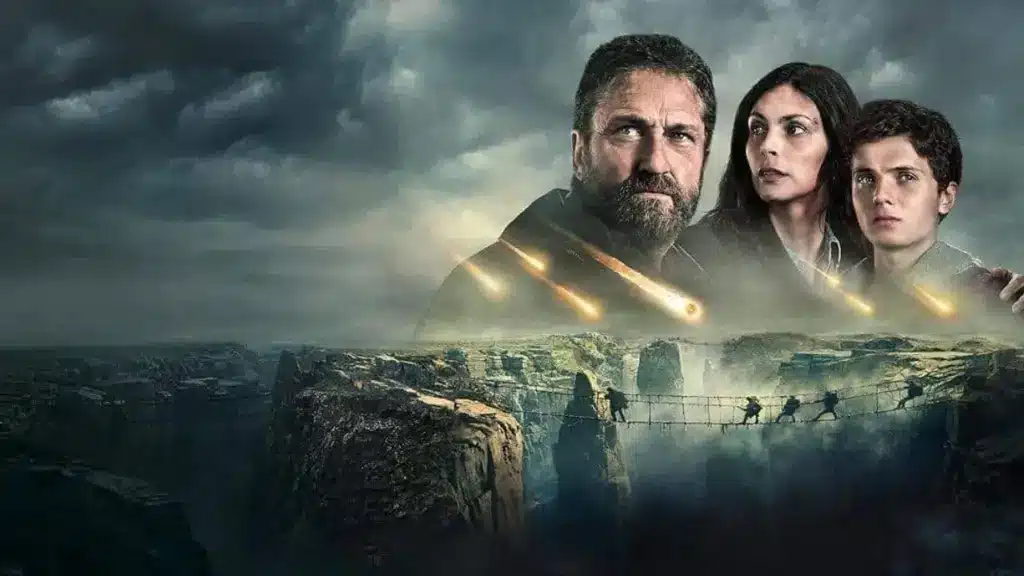 Gerard Butler e Morena Baccarin em cena de Destruição Final 2, atravessando paisagem devastada da Europa após o apocalipse