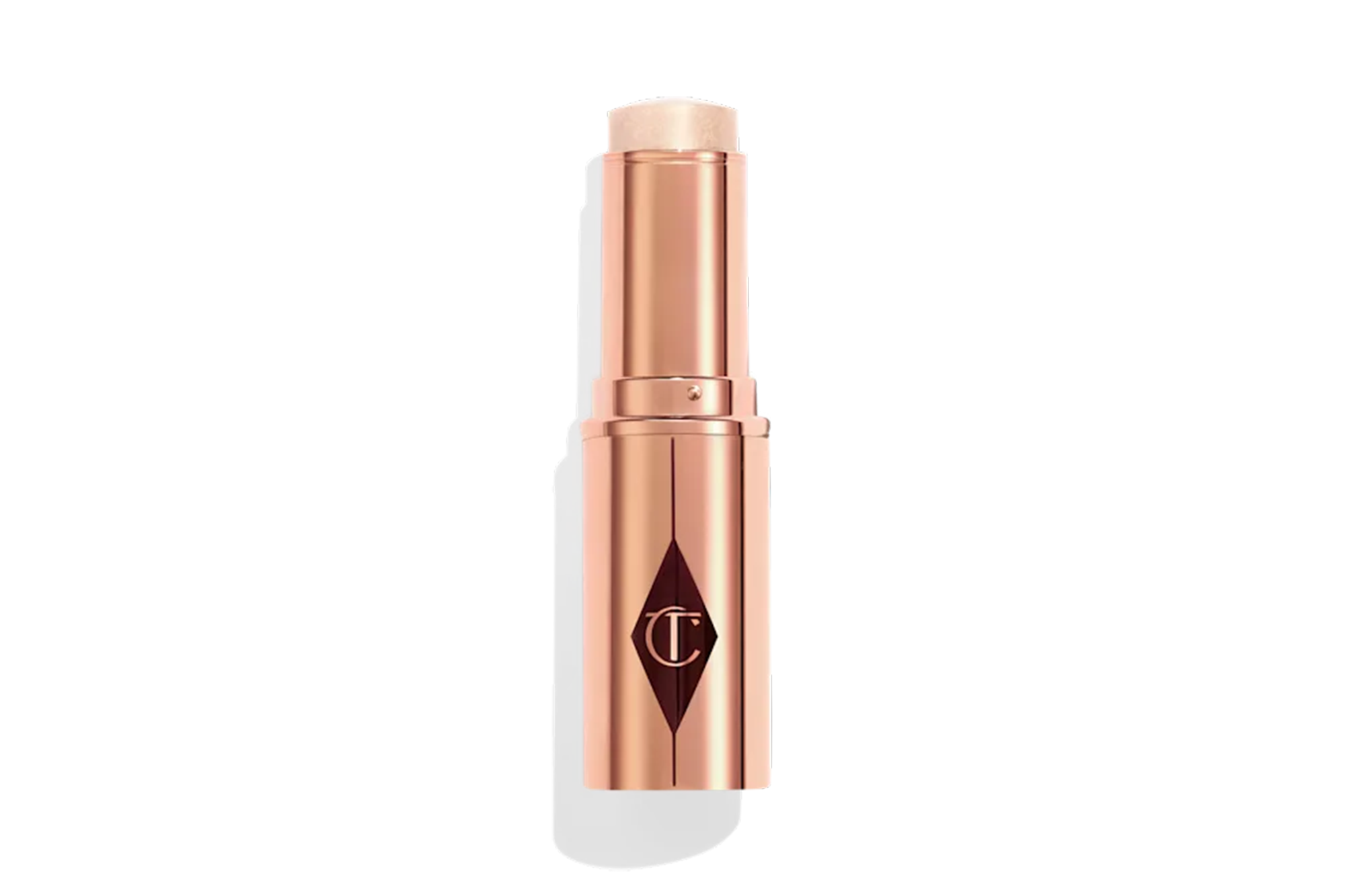 Unreal Highlighter em bastão da Charlotte Tilbury com embalagem rose gold