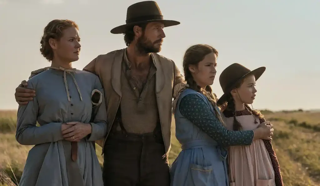 Charles e família Ingalls em cena do episódio final de Uma Casa na Pradaria